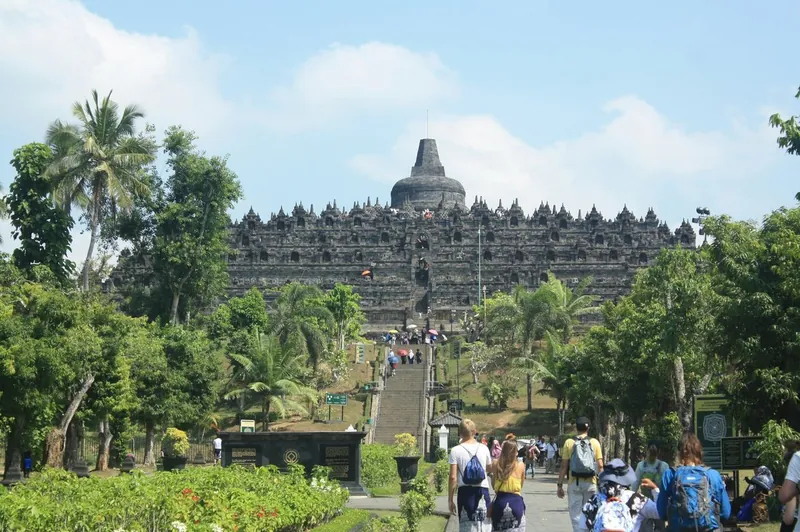 Road through rice paddies approaching Borobudur Temple from Yogyakarta