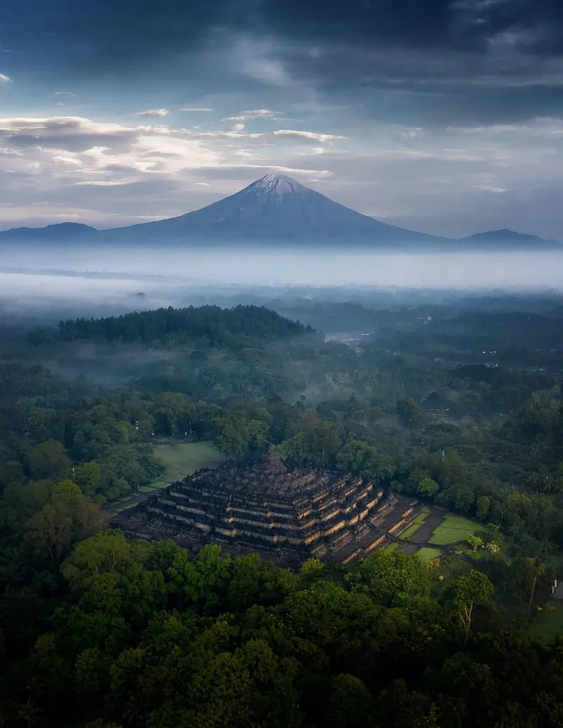 Visitors in light clothing climbing Borobudur Temple wearing Upanat sandals